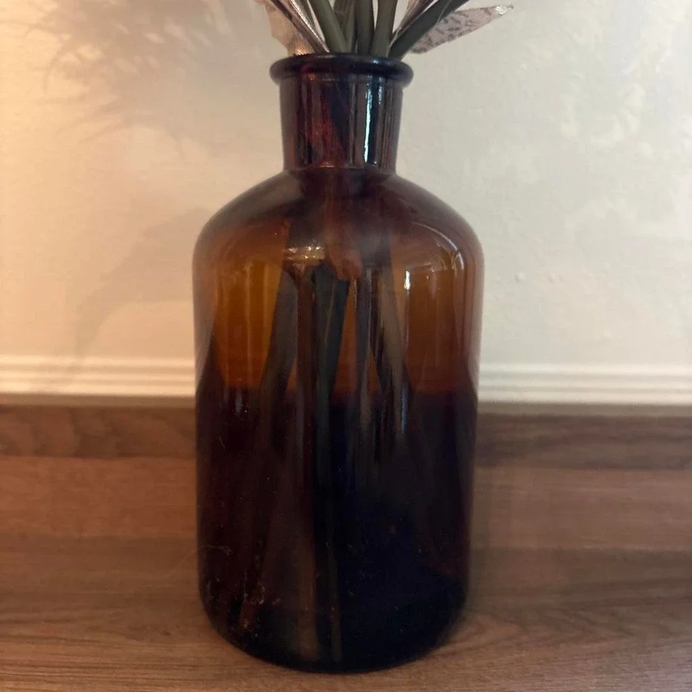 Brown glass vase with fake dried flowers Glass is 7
